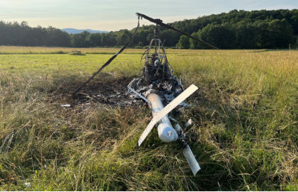 Photograph 3 – Aft view of upright post-crash fire damaged helicopter., from the NTSB investigation of Amateur-built ROTORWAY EXEC 162F accident near Towanda, Pennsylvania, July 4, 2025