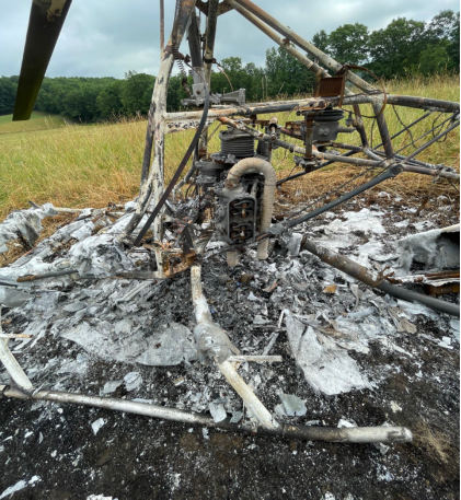 Photograph 5 – View of post-crash fire damaged engine., from the NTSB investigation of Amateur-built ROTORWAY EXEC 162F accident near Towanda, Pennsylvania, July 4, 2025