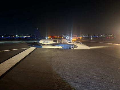 Photograph 2 –Right Forward Quartering View of the Airplane on the Runway, from the NTSB investigation of Piper PA34 accident near Fort Lauderdale, Florida, July 10, 2025