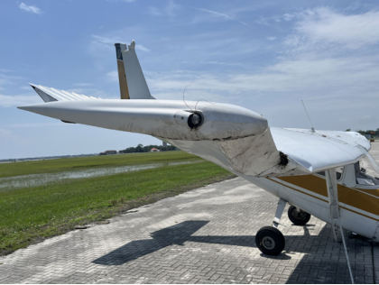 Photograph 2 – Main wreckage, right wing view, from the NTSB investigation of Cessna 150 accident near St. Augustine, Florida, July 11, 2025
