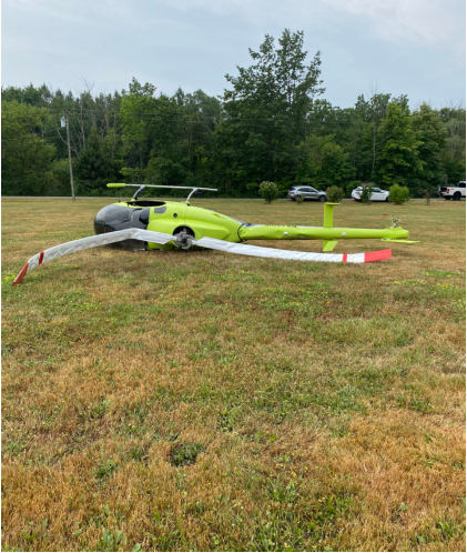 Photograph 2 – Top View of the Helicopter Resting on Its Left Side, from the NTSB investigation of Amateur-built EXEC 162F accident near Holley, New York, July 30, 2025