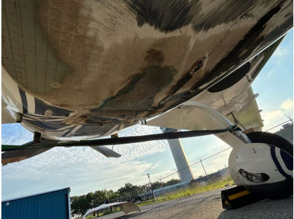 Photograph 4 – Damage to underside of airplane, from the NTSB investigation of Amateur-built VELOCITY XL RG accident near Columbia, South Carolina, August 12, 2025