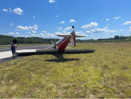 Photograph 1 – Deformation noted to rudder and vertical stabilizer, from the NTSB investigation of Cessna 170 accident near Fitchburg, Massachusetts, August 23, 2025