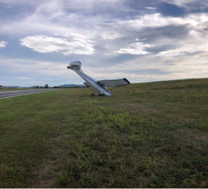 Photograph 1 – View of airplane off side of runway 03., from the NTSB investigation of Cessna 170B accident near Knoxville, Tennessee, August 25, 2025