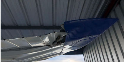 Photograph 2 – View of underside of right wing bent tip., from the NTSB investigation of Cessna 170B accident near Knoxville, Tennessee, August 25, 2025