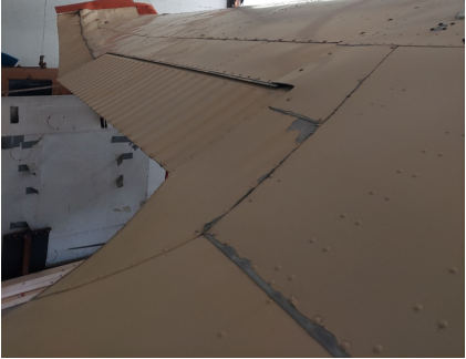 Photograph 1 – Deformation noted to left wing, from the NTSB investigation of Cessna 170B accident near Livermore Falls, Maine, August 23, 2025