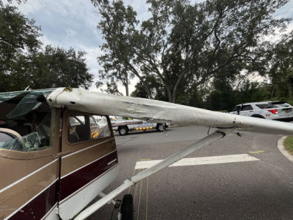 Photograph 2 – View of damage to the left wing., from the NTSB investigation of Cessna 172 accident near New Smyrna Beach, Florida, August 29, 2025