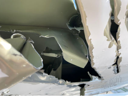 Photograph 4 – Close up View Showing Right Wing Spar Damage to N6185U, from the NTSB investigation of Cessna 150 and Cessna 172 accident near Farmingdale, New York, August 30, 2025