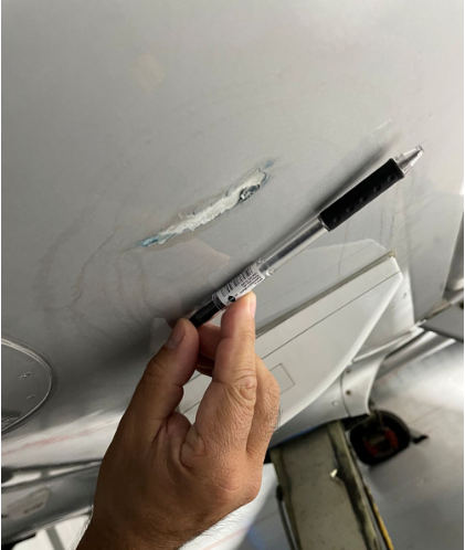 Photograph 2 – Left Fuel Cell Breach, from the NTSB investigation of Cirrus Design CORP SR22 accident near West Milford, New Jersey, September 28, 2025