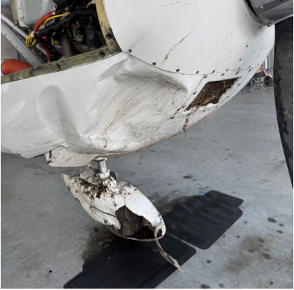 Photograph 1 – View of right-hand side of aircraft nose showing impact damage, from the NTSB investigation of Cessna T182T accident near Venice, Florida, October 4, 2025