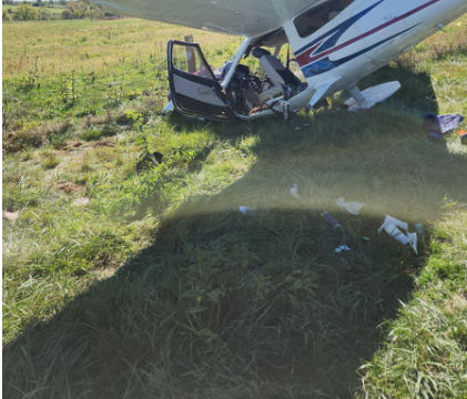 Photograph 1 – Left side view of airplane damage., from the NTSB investigation of Cessna 177 accident near Cynthiana, Kentucky, October 16, 2025