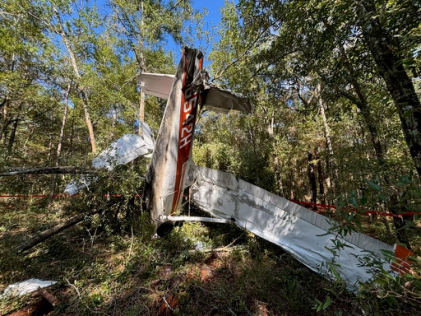 Photograph 2 – View of the airplane at the accident site., from the NTSB investigation of Cessna 172 accident near Pensacola, Florida, December 7, 2025