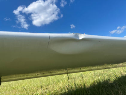 Photograph 2 – Damage to leading edge of left wing, from the NTSB investigation of I.C.A.-Brasov (Romania) IS-28B2 accident near Scotts Fork, Virginia, May 12, 2026