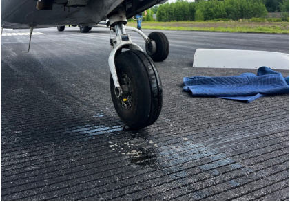 Photograph 1 – Nose landing gear and lower forward fuselage damage, from the NTSB investigation of Cessna R182 accident near Fitchburg, Massachusetts, May 26, 2026