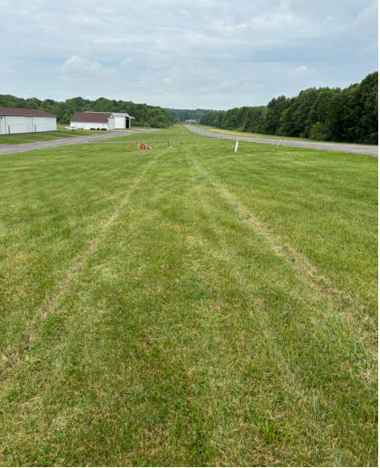 Photograph 4 – Landing Gear Grass Impressions Toward VASI Light, from the NTSB investigation of Amateur-built LANCAIR ES accident near Youngstown, Ohio, June 8, 2026