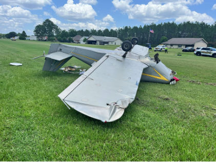 Photograph 2 – Deformation noted to fuselage and left wing., from the NTSB investigation of Amateur-built Playmate accident near Green Cove Springs, Florida, July 9, 2026