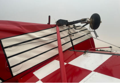 Photograph 2 – Damage to Empennage, from the NTSB investigation of Christen Industries INC PITTS S-2 accident near Porter Center, New York, July 17, 2026