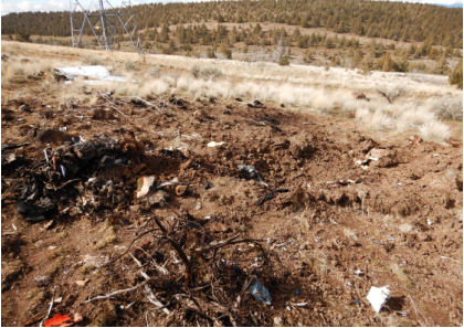 Photograph 4 – View of engine at end of accident trench, from the NTSB investigation of Piper PA-32-260 accident near Madras, Oregon, March 10, 2024