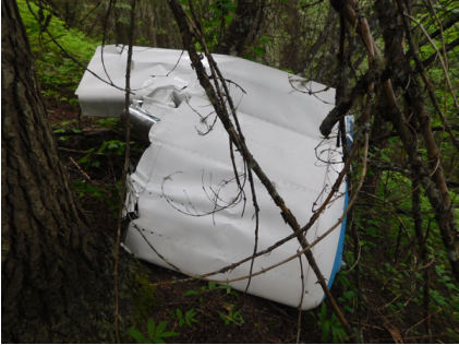 ON SCENE INVESTIGATION PHOTOGRAPHS Photograph 5 – Outboard portion of left wing with aileron attached., from the NTSB investigation of Cessna 177B accident near Elk River, Idaho, June 12, 2024