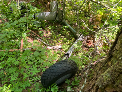 Photograph 5 – Main landing gear assembly., from the NTSB investigation of Boeing A75L3 accident near Yacolt, Washington, September 6, 2024