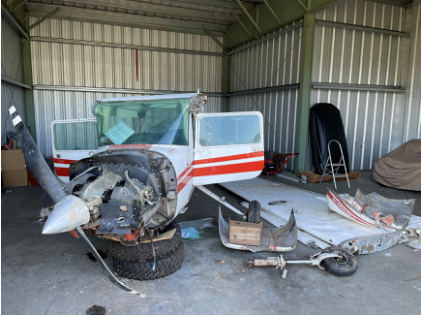 Photograph 2 - View of recovered airplane at follow-up examination., from the NTSB investigation of Cessna 150M accident near Woodland, Washington, November 18, 2023
