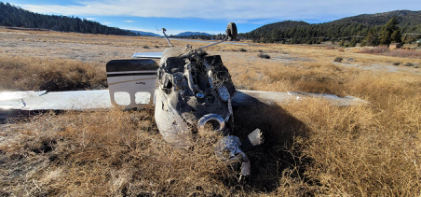 Photograph 1 – Accident site, main wreckage, from the NTSB investigation of Cessna P210N accident near Big Bear, California, December 2, 2023