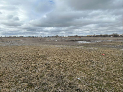 Photograph 1 – Airplane’s tire markings in the grass off the departure end of the runway., from the NTSB investigation of Mooney M20K accident near Burley, Idaho, February 10, 2024