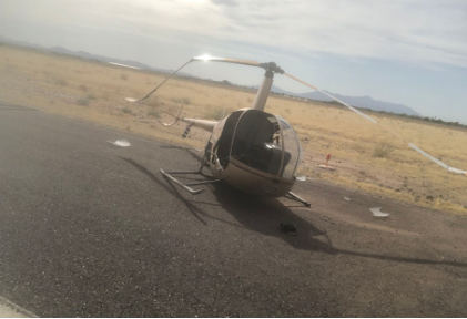 Photograph 1 – View of damage to main rotor blades, from the NTSB investigation of Robinson Helicopter R22 BETA accident near Maricopa, Arizona, June 6, 2024