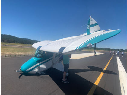 Photo 1 – View of accident airplane from left wing; note damage outboard and to forward fuselage, from the NTSB investigation of Piper PA-22-150 accident near Sunriver, Oregon, July 6, 2024
