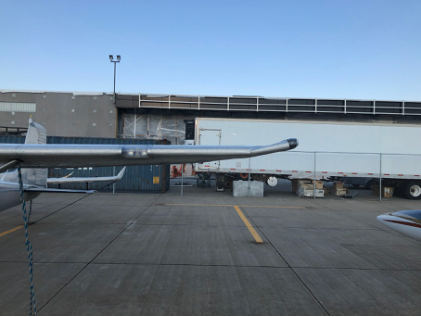 Photograph 1 – View of substantial damage to the left wing., from the NTSB investigation of Cessna 182A accident near Teton Village, Wyoming, July 10, 2024