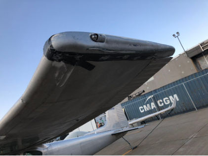 Photograph 2 – View of substantial damage to the left wing., from the NTSB investigation of Cessna 182A accident near Teton Village, Wyoming, July 10, 2024