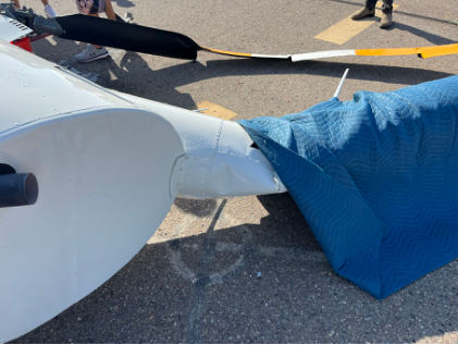 Photograph 3 – View of substantial damage to tailboom., from the NTSB investigation of Robinson Helicopter R44 accident near Carlsbad, California, July 18, 2024