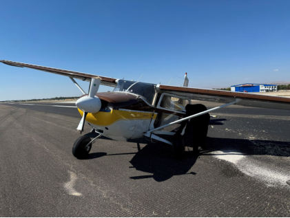 Photograph 1 – View of airplane from forward left., from the NTSB investigation of Cessna 180A accident near Boise, Idaho, August 17, 2024