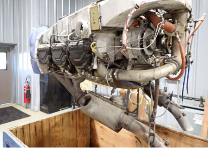 Photograph 2 – Engine removal from crate., from the NTSB investigation of Cessna U206G accident near West Sacramento, California, September 19, 2024