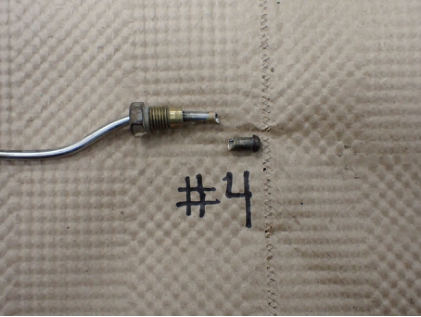 Photograph 5 - Cylinder number 4 fuel injection assembly tube., from the NTSB investigation of Cessna U206G accident near West Sacramento, California, September 19, 2024