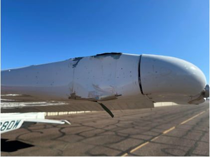 Photograph 1: Airplane’s left wing as viewed from the front., from the NTSB investigation of Cessna 172S accident near Chandler, Arizona, May 11, 2024