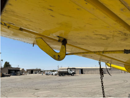 Photograph 3 – Damaged aileron hinge and boost tab control rod, from the NTSB investigation of Air Tractor AT502 accident near Corcoran, California, October 8, 2024