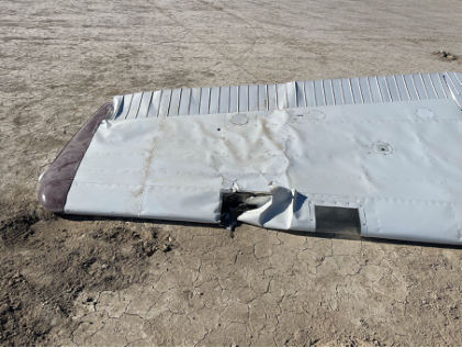 Photograph 4 – View of substantial damage to the left wing., from the NTSB investigation of Cessna 180 accident near Venator, Oregon, October 6, 2024