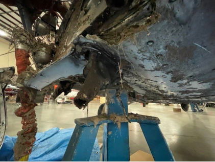 Photograph 3 – View of substantial damage to lower forward fuselage., from the NTSB investigation of Cessna 172M accident near Gig Harbor, Washington, December 13, 2024
