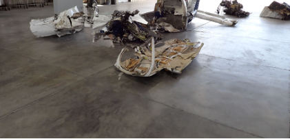Photograph 1 – Airplane wreckage layout following initial recovery, from the NTSB investigation of Piper PA-32-300 accident near Round Mountain, Nevada, January 2, 2025