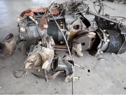 Photograph 2 – Forward engine case during initial layout, from the NTSB investigation of Piper PA-32-300 accident near Round Mountain, Nevada, January 2, 2025