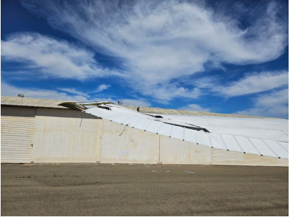 Photograph 2 – View of damage to the left wing and aileron, from the NTSB investigation of Cessna 180J accident near Oakland, California, April 10, 2025