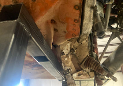 Photograph 2 – Damaged Firewall, Fuselage, and Steering Shaft, from the NTSB investigation of Cessna 182F accident near Nephi, Utah, June 29, 2025