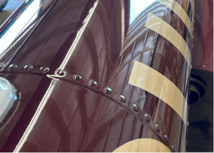 Photograph 1 – View of substantial damage to the tailboom., from the NTSB investigation of Robinson Helicopter CO R66 accident near Tukwila, Washington, June 30, 2025