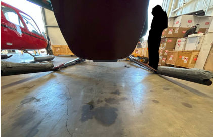 Photograph 2 – Deformation of the helicopter skids., from the NTSB investigation of Robinson Helicopter CO R66 accident near Tukwila, Washington, June 30, 2025