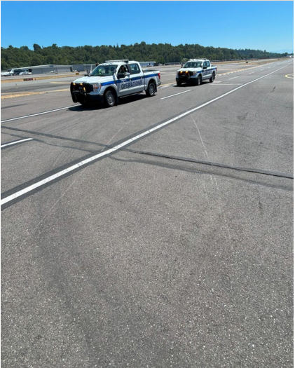 Photograph 3 – Scrapes on ramp surface from helicopter impact., from the NTSB investigation of Robinson Helicopter CO R66 accident near Tukwila, Washington, June 30, 2025