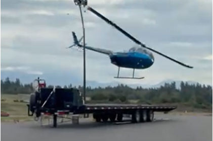Photo 1 – View of the helicopter’s right side tailboom striking light pole, from the NTSB investigation of Robinson Helicopter Company R44 II accident near Burlington, Washington, August 18, 2025