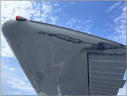 Photograph 2 –Left wing tip fairing and aileron damage., from the NTSB investigation of Cessna 170A accident near Everett, Washington, August 27, 2025
