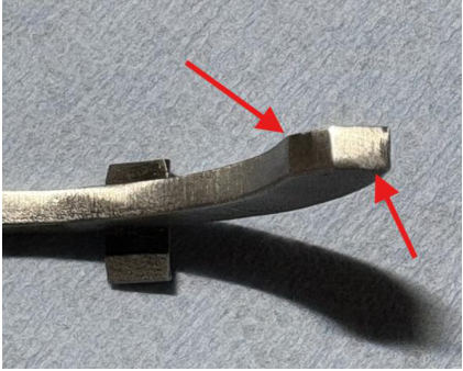 Photograph 9 – Tailwheel pawl Arrows indicate worn/rounded areas, from the NTSB investigation of Cessna 305 accident near Phoenix, Arizona, October 18, 2025