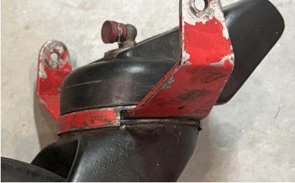 The lock pawl exhibited rounded edges and displayed an appearance consistent with mechanical abrasion/cleaning, likely from the use of a mechanical wire wheel. Slight outward material displacement was observed along each edge of the pawl sl, from the NTSB investigation of Cessna 305 accident near Phoenix, Arizona, October 18, 2025